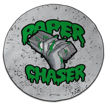 Paper Chaser graphic round rug with stacked cash artwork and Jet Black edge finish shown from above on white background