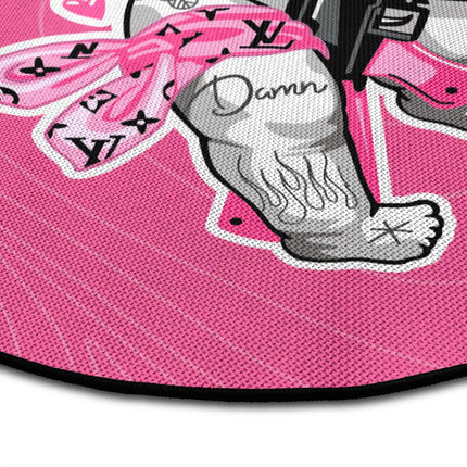 Close up of Pink Bandit graphic round rug with masked cupid artwork showing Jet Black edge and woven polyester texture