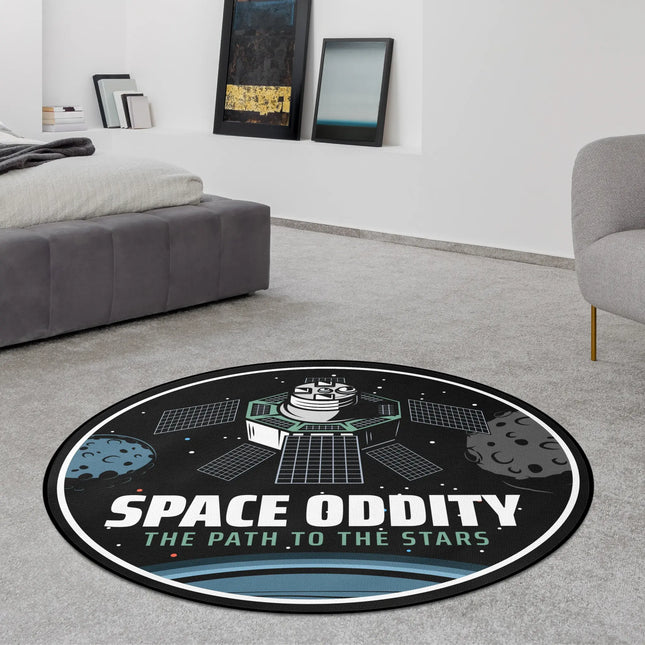 Black space oddity graphic round rug with satellite, planets and orbit design styled in a modern bedroom with Jet Black edge finish