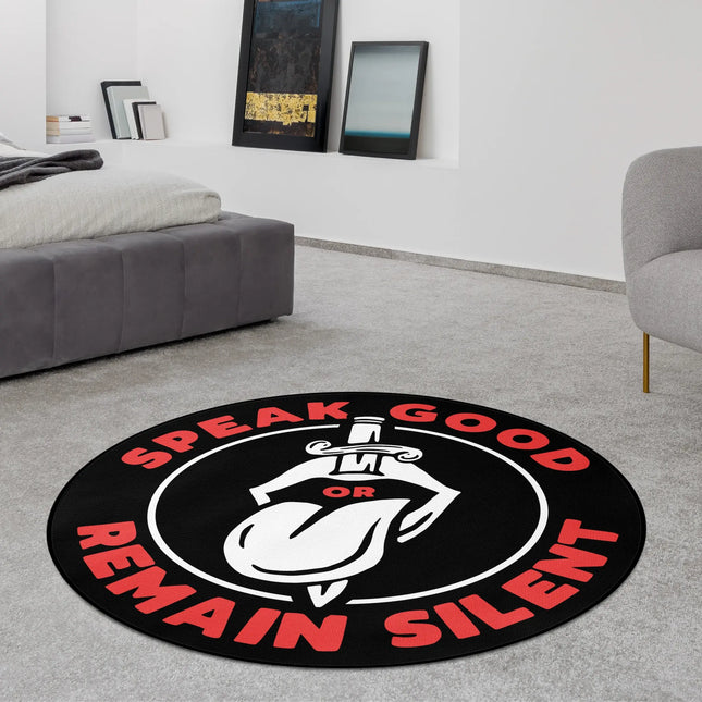 Speak Good Or Remain Silent graphic round rug with geometric line artwork styled in a modern bedroom with Jet Black edge finish