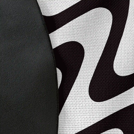 Close up of woven polyester material on static flow graphic round rug with Jet Black edge finish showing monochrome wave print detail