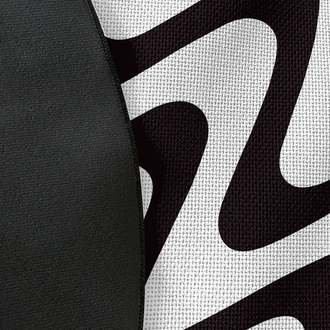 Close up of woven polyester material on static flow graphic round rug with Jet Black edge finish showing monochrome wave print detail