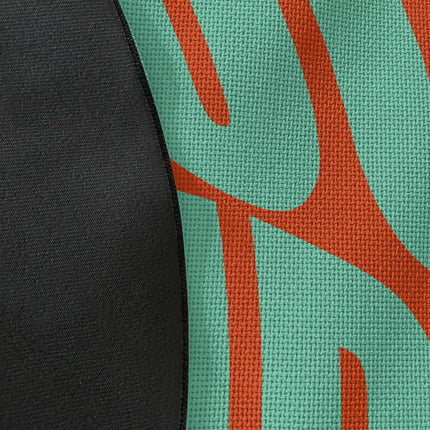 Close up of woven polyester material on sunset good vibes round rug with Jet Black edge showing detailed retro typography print texture