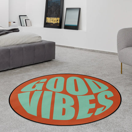 Sunset good vibes round rug with oversized mint green typography on a burnt orange background styled in a modern bedroom with Jet Black edge finish
