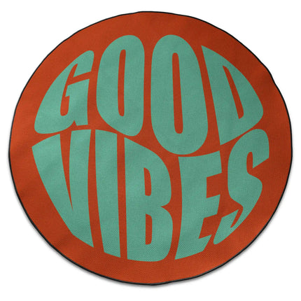 Sunset good vibes round rug with oversized mint green typography shown from above on white background with Jet Black edge finish