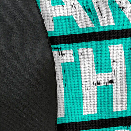 Close up of woven polyester material on take the risk graphic round rug with Jet Black edge finish showing typography and brushstroke print detail