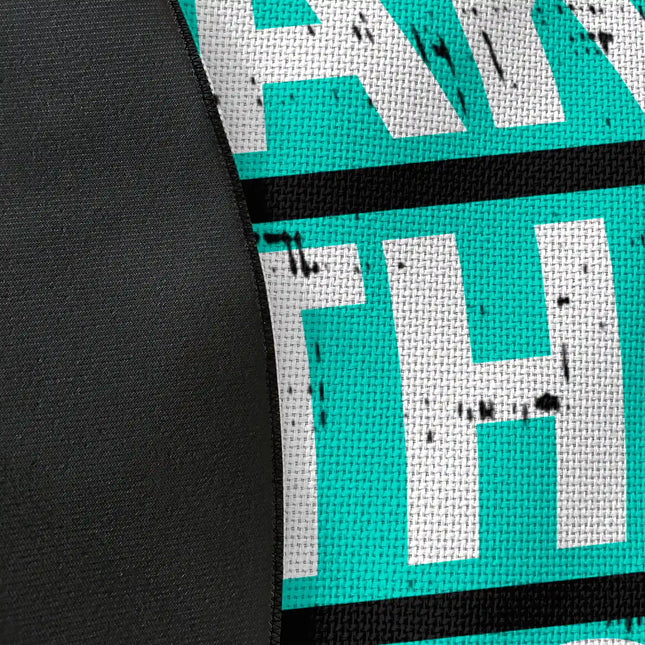 Close up of woven polyester material on take the risk graphic round rug with Jet Black edge finish showing typography and brushstroke print detail
