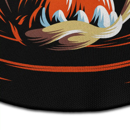 Close up of Tasmanian Devil graphic round rug showing Jet Black edge and woven polyester texture