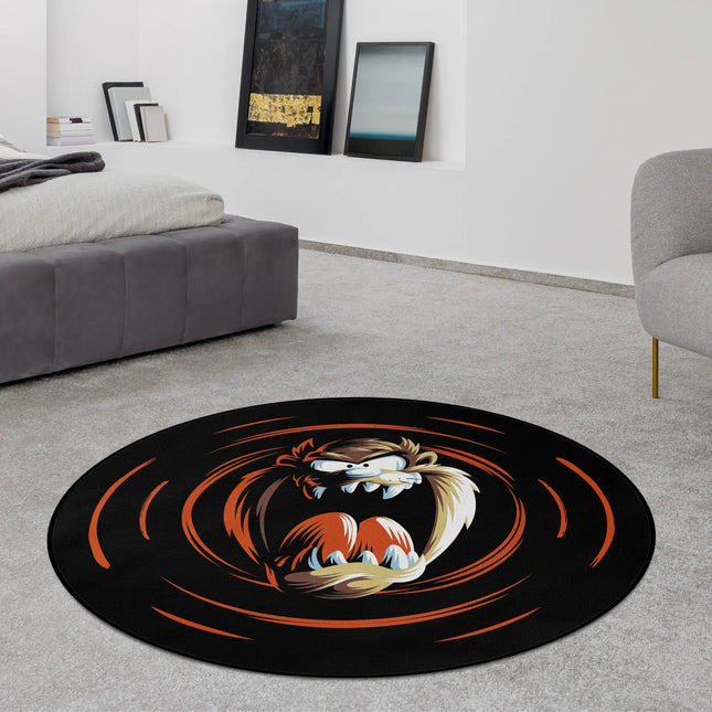 Black Tasmanian Devil graphic round rug with cartoon character and swirling orange motion design styled in a modern bedroom with Jet Black edge