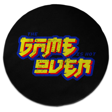 “The Game Is Not Over” graphic round rug with Jet Black edge finish shown from above on white background