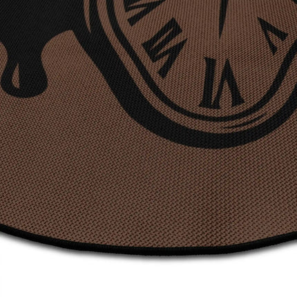 Close up of Time Collapse graphic round rug with surreal melting clock artwork showing Jet Black edge and woven polyester texture