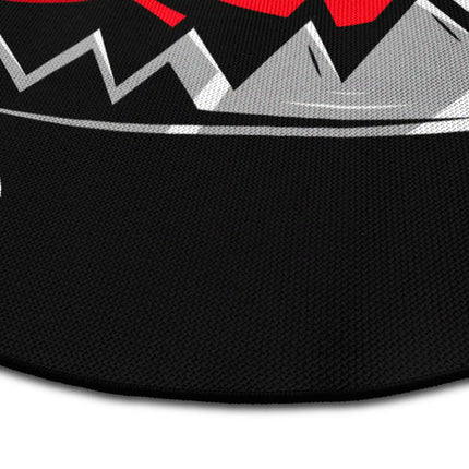 Close up of trapped heart graphic round rug Jet Black edge showing woven polyester detail