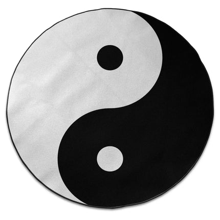 Yin yang graphic round rug with Jet Black edge finish shown from above on white background